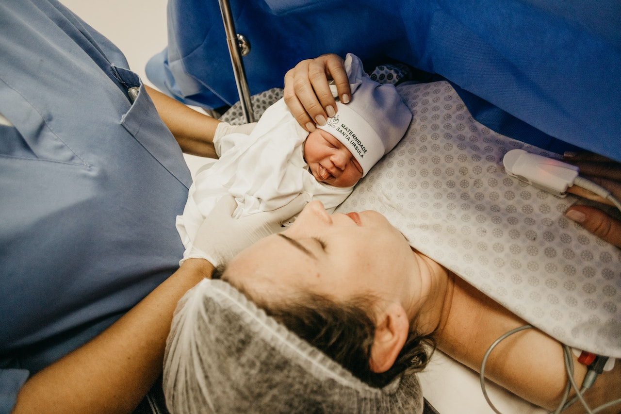 Patient lying in a hospital bed for an embryo transfer procedure